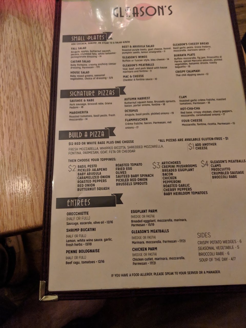 Printed menu featuring flatbread pizza and small plates
